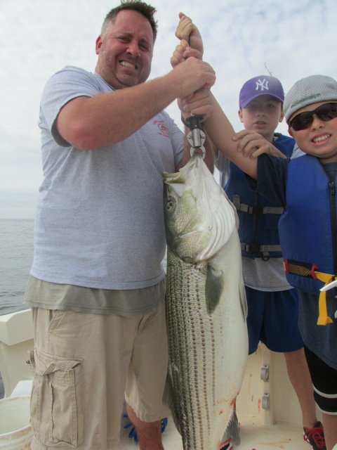 Joel Martin holding 29# striper